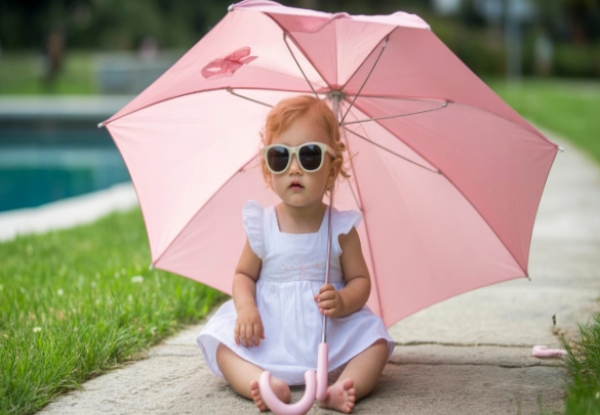 baby girl wearing clothing accessories like eyewear and umbrella